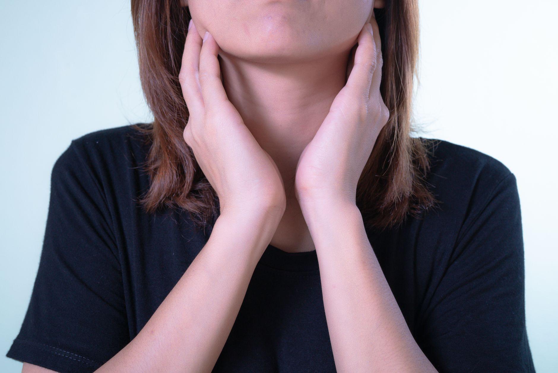 A close-up illustration of a healthy thyroid gland highlighting the importance of addressing root thyroid dysfunction.