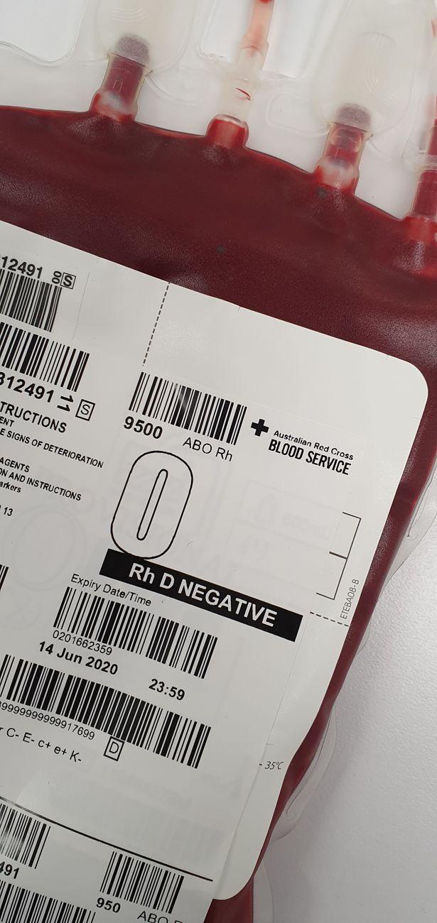 A drop of O negative blood in a clear vial, representing the universal donor blood type.